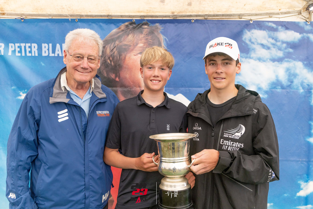 William Mason with the Sir Peter Blake Memorial Trophy, alongside PJ Montgomery and Sean Kensington